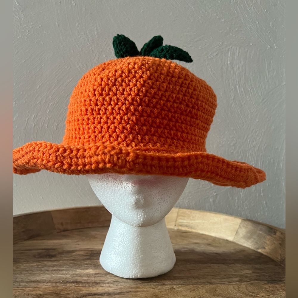 Handmade (knitted) carrot flappy hat.
